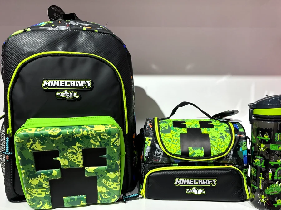 A Minecraft backpack, lunch bag and drink bottle on the shop counter